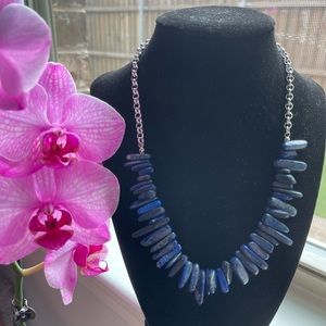 Silver aluminum and blue short necklace.